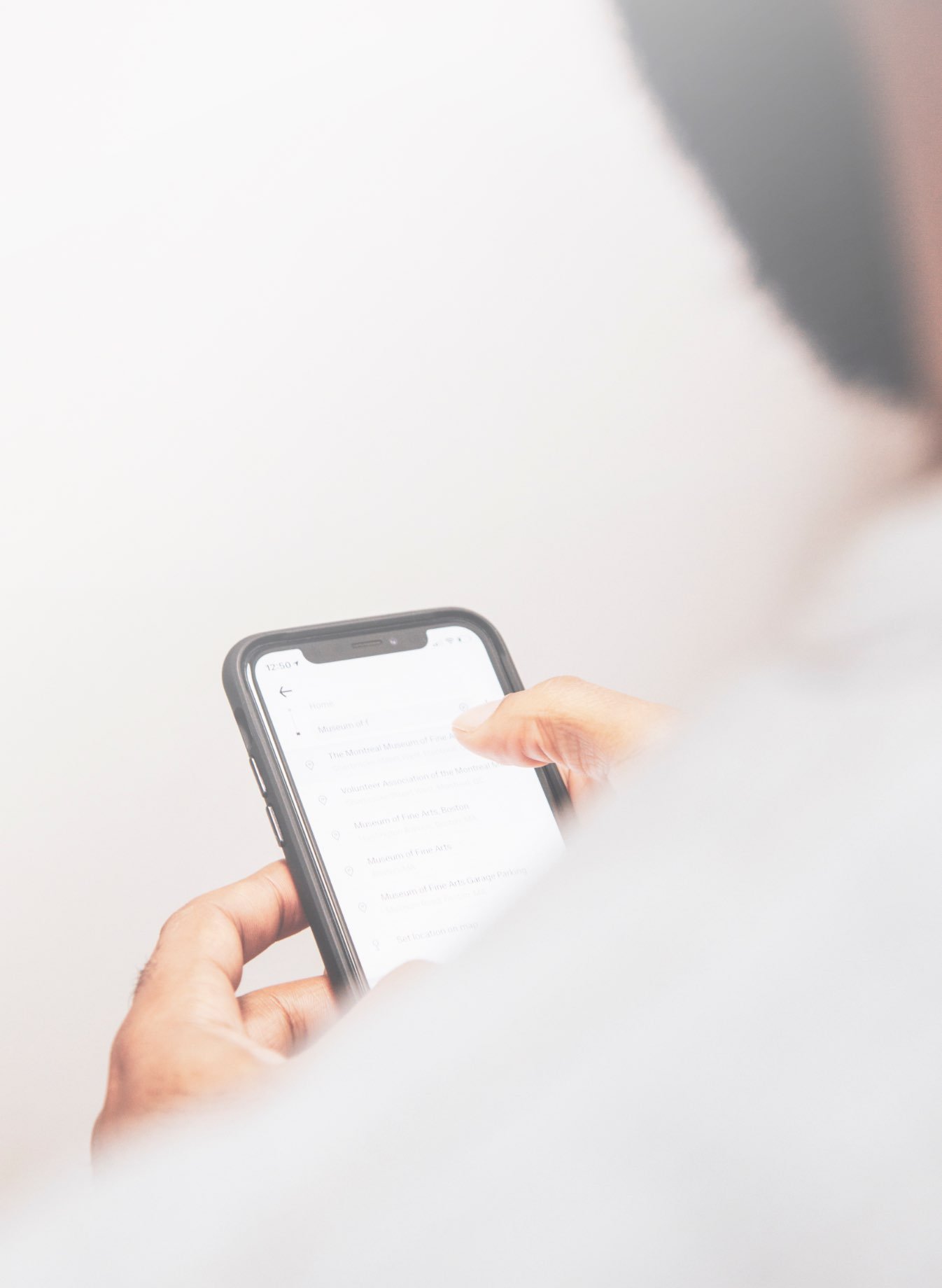 A person looking at their mobile phone screen