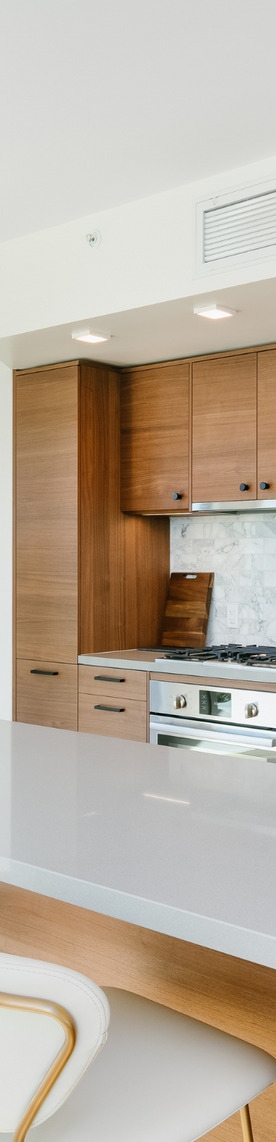 a kitchen with wood cabinets and a stove